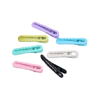 Set of 7 colorful macaron wave hair clips in matte and glossy finishes on white background