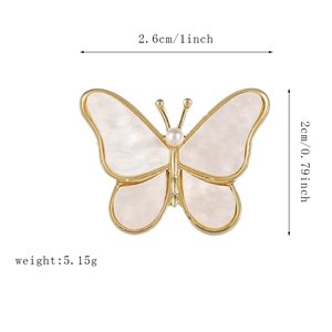 Detailed view of gold butterfly brooch dimensions 2.6cm by 2cm with weight 5.15g