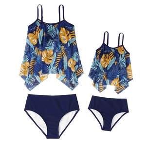 Detail view of parent-child two-piece tankini with blue tropical palm leaf print