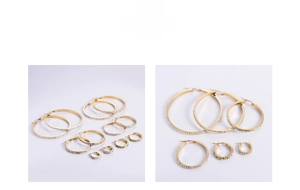 Detail view of various sizes of gold plated hoop earrings with inlaid white rhinestones