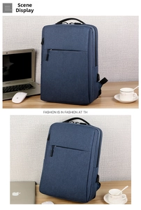 Detailed view of the blue business laptop backpack showing textured fabric and USB port