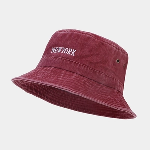 Close-up of vintage washed cotton bucket hat in burgundy with New York embroidery