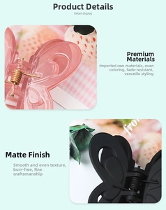 Close-up detail of butterfly hair clips in translucent pink and matte black finishes