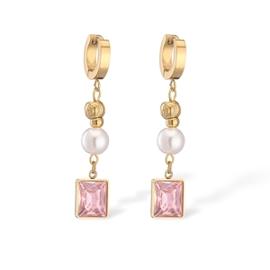 Gold-plated drop earrings with pink square gemstones and white pearls on white background