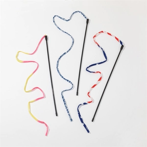 Close-up of three colorful fabric ribbon cat wands with starry and gradient patterns