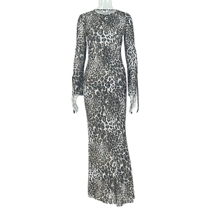 Detail of long sleeve leopard print maxi dress featuring round neck and cuff tie accents