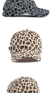 Detailed close-up showing leopard print corduroy baseball cap texture and buckle