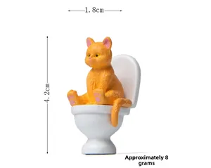 Miniature orange cat on toilet resin figurine, dimensions 1.8cm by 4.2cm, weight 8g