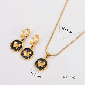 Golden stainless steel jewelry set featuring black round butterfly necklace and earrings