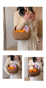 Detail of hand-woven brown basket bag with silk scarf and fresh citrus fruits