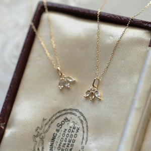 Exquisite gold S925 silver necklace with three marquise crystals in a vintage jewelry box