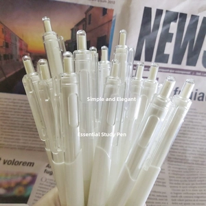 Close-up of sleek white retractable gel pens on vintage newspaper for exam study