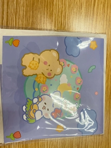 Macro shot of 3D birthday card featuring cute bear and rabbit characters in packaging