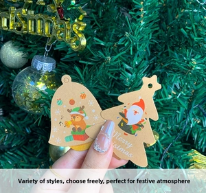 Close-up of DIY Kraft paper Christmas tags with reindeer and Santa Claus illustrations