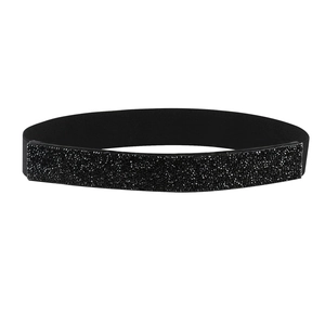 Close-up of black rhinestone embellishment and elastic fabric texture on this wide belt