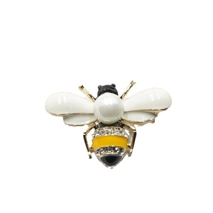 Elegant gold bee brooch with white enamel wings and large pearl center accessory