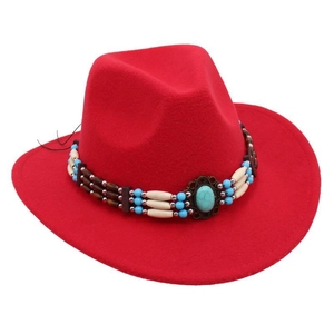 Close-up of red felt cowboy hat featuring turquoise beads and ethnic style band