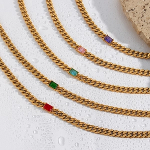 Detailed view of 5 golden 6.5mm Cuban link necklaces with colorful rectangle zircons