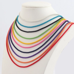 Colorful bead chain necklaces in various candy colors shown on a white mannequin bust