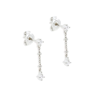 Macro detail of S925 sterling silver tassel earrings with sparkling zircon and chain drop