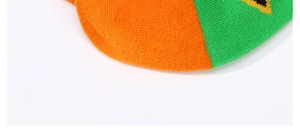 Macro shot of orange and green color-block cotton knit fabric texture on socks