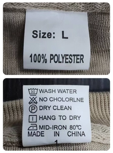 Detail view of T-shirt neck label showing size L and 100% polyester fabric composition