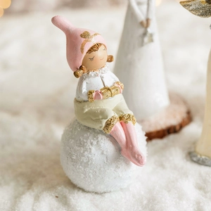 Pink hat Christmas angel girl figurine sitting on white snowball resin desktop ornament