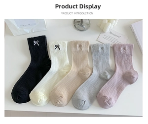 Detail view of 5-pack ballet-style ribbed cotton socks with bow embroidery in soft pastel tones