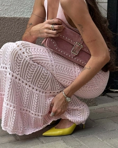 Detail view of pink crochet knit texture and hollow out pattern on the long mermaid skirt