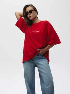 Close-up of Oh Jesus text print on a red oversized heavy cotton T-shirt
