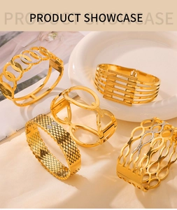 Close-up of geometric gold-plated titanium steel bangles with sparkling diamond accents