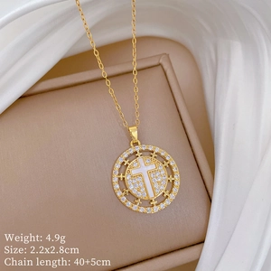 Detail of gold titanium cross pendant with clear zircons and 40+5cm chain specs