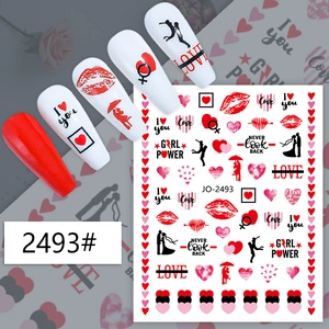 Detail of red and black Valentine nail stickers with heart and lip patterns on fake nails