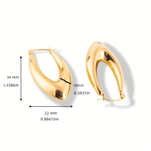 Polished gold hollow earrings detail with dimensions 34mm height and 22mm width