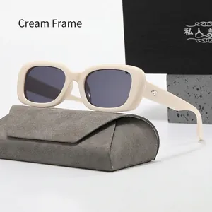 Detail of cream rectangle sunglasses with polarized lenses and premium matte storage case