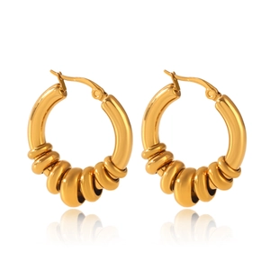 Macro detail of gold stainless steel hoop earrings with textured spiral thread design