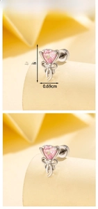 Detailed view of pink heart earring with bow design and precise size measurements