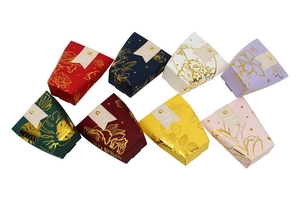 Detail of gold foil floral trapezoid gift boxes with Thank You tags in 8 assorted colors
