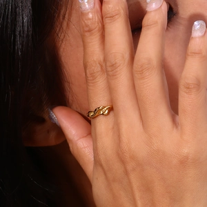 Modern 18K gold plated stainless steel wave ring with a minimalist irregular twisted design