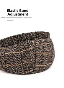 Close-up of herringbone tweed baker boy hat with elastic adjustment strap detail