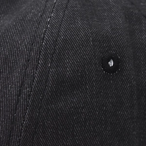 Close-up of high-quality cotton twill fabric and embroidered ventilation eyelet on cap