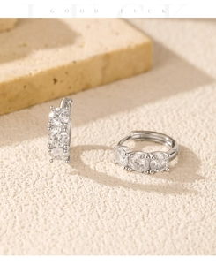 Macro view of S925 sterling silver hoop earrings with VVS1 moissanite stones