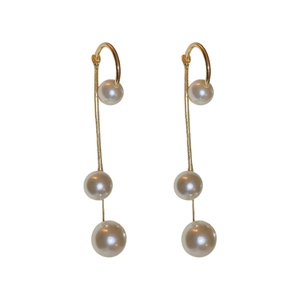 Elegant gold metal fringe long earrings with white faux pearls on white background