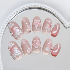 3D Lily pearl press-on nails with pink gradient and white floral accents on mirror