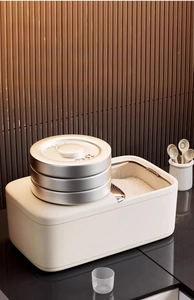 Strong load-bearing test showing heavy weights on a thickened white rice storage container