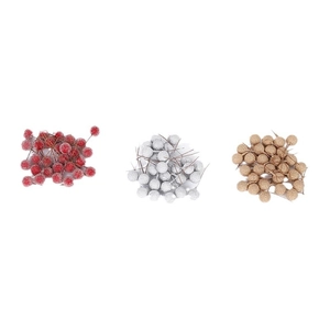 Glittery artificial Christmas berries in red silver and gold for festive floral arrangements