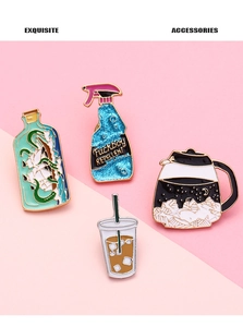 Detailed macro view of four creative zinc alloy enamel pins with artistic drink designs