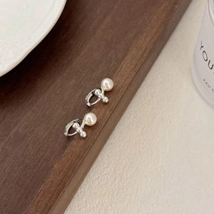 Elegant 925 sterling silver triple pearl stud earrings for women on minimalist background