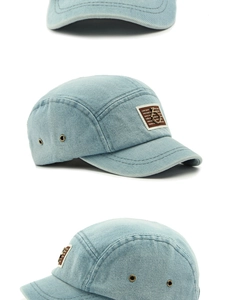Λεπτομέρεια καπέλου 5-panel από πλυμένο τζιν με δερμάτινο σήμα και μεταλλικό κρίκο