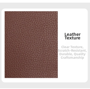 Close-up of scratch-resistant brown lychee grain leather texture on a men's cross-body bag